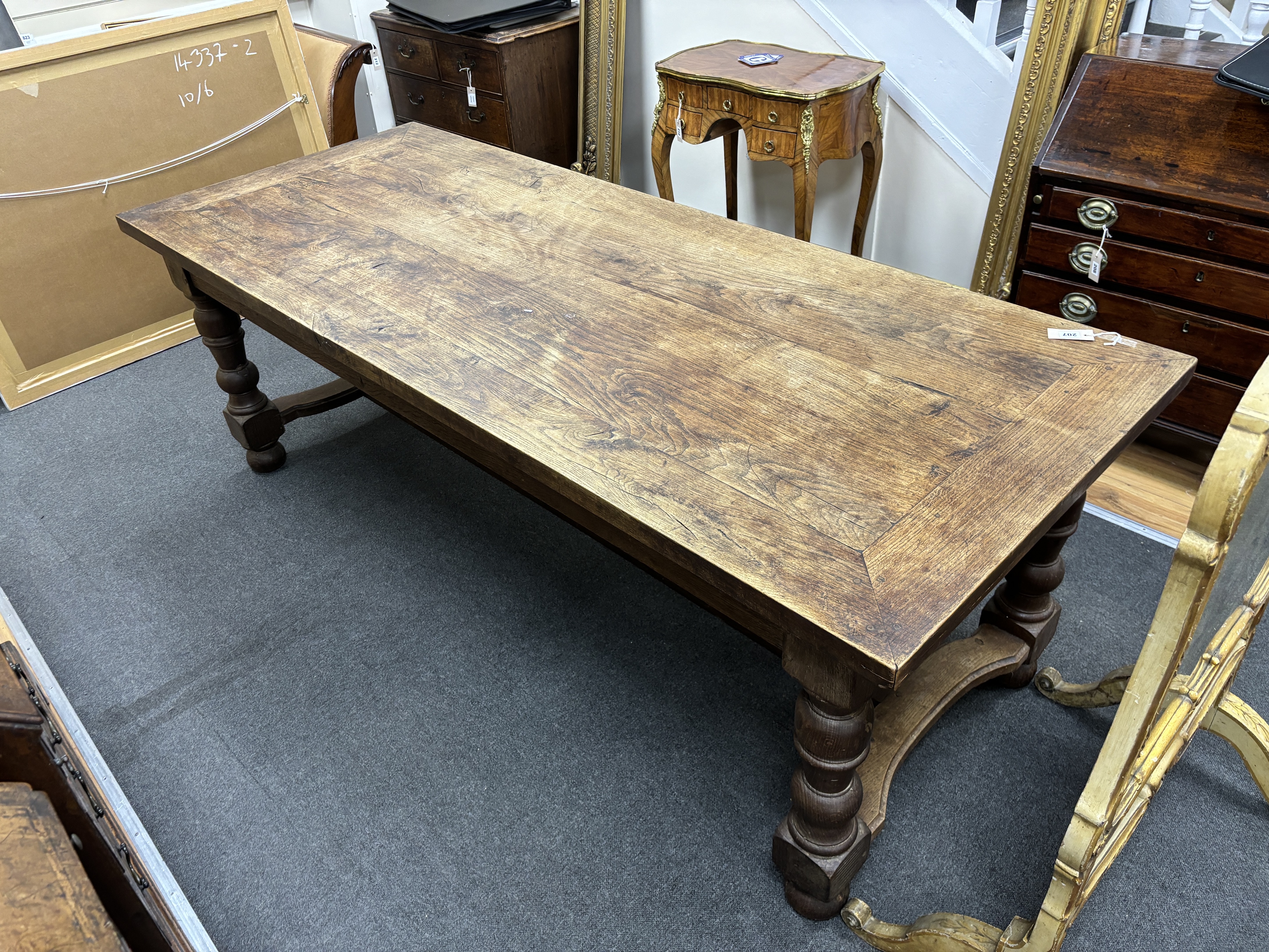 A rectangular oak refectory dining table, length 217cm, width 87cm, height 74cm